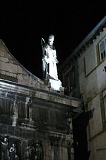 Statue of Saint Justus atop the church dedicated to him at Lyon, France.