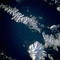 Image of the islands taken by the STS-56 crew. Amlia Island is visible in the upper left of the photo, while the eastern half of Atka Island is shown at the right. North is to the bottom left in this photo.