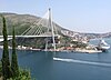 Picture of the southern end of the Franjo Tuđman Bridge, with the port of Dubrovnik in the background