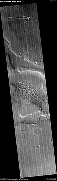 Wide view of honeycomb shapes and possible dikes that make an "X" shape, as seen by HiRISE under HiWish program