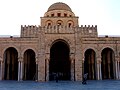 Porch topped with a ribbed dome rising in the middle of the south portico of the courtyard