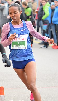 Image of a woman in running kit
