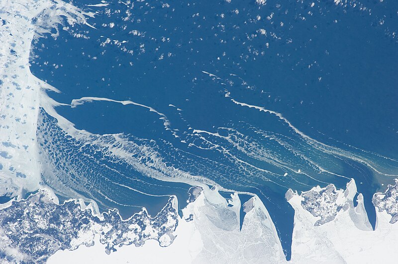 The Potawatomi Islands in February as the ice is breaking up. The edge of the Garden Peninsula to the north is on the left, and the edge of the Door Peninsula to the south is on the right.