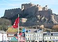 The pier below the castle contains restaurants, cafés and shops