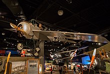 A museum exhibit showing vintage airplanes