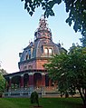 Large ornate house, with a level of decoration more usually associated with public buildings. Originally more modest in conception, the house was built in 1860 and the dome was added during 1872–1876. Armour–Stiner House, Irvington, New York.[5]