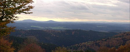 View from the Simmersberg ({{Subst:Formatnum:781}} m) in the Thuringian Highland of the Gleichberge, 24 km away. Right rear: the Rhön and the Kreuzberg ({{Subst:Formatnum:927.8}} m), 67 km away. Centre, half right: the Ratscher Bergsee lake, 7 km away