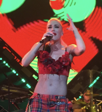 A color photograph of Gwen Stefani performing.