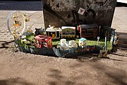 Miniature street model of an amusement park surrounded by a fence