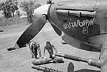 RAF personnel rolling a 250lb bomb for loading onto Hawker Hurricane Mk II.C Hellzapoppin of No. 11 Squadron, at Sinthe, Burma in the early 1940s.