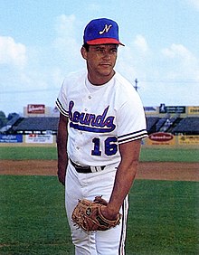 A baseball player in white