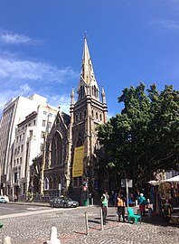 A yellow banner on the church celebrating Nelson Mandela.