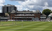 Colour photograph showing a cricket ground
