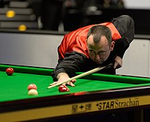 Mark Williams playing a shot