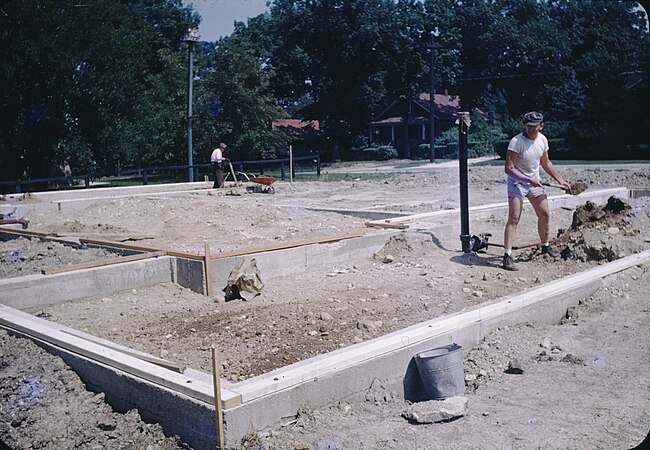 Shoveling dirt for the foundation of his first house