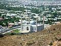 View of Osh seen downhill across cemetery and mosque