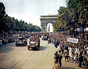 The French Second Armored Division of General Philippe Leclerc de Hauteclocque parades on the Champs-Élysées on 26 August 1944. (Kodachrome by Jack Downey, U.S. Office of War Information)