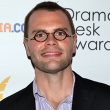 A photo of Samuel D. Hunter smiling at an awards ceremony