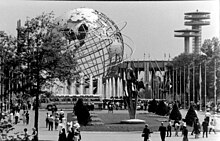 A black-and-white picture of the fairground, looking south from the Unisphere toward the New York State Pavilion