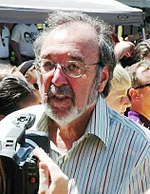 James L. Brooks standing in a crowd being photographed