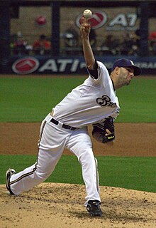 A baseball player in white