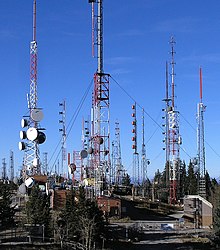 A mountaintop with many broadcast towers