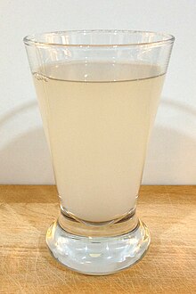 Photo of a glass misty coloured liquid