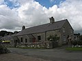 Yr Hen Ysgol - a former school building facing the green at Marian-Glas