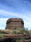 The fort is hexagonal in form This stone fort was erected in 1900 by British soldiers to strengthen their position at Prieska. The structure, which is hexagonal, -is a good example of the preserverance and excellent craftsmanship of the British soldiers during the Anglo Boer War (1899 Type of site: Blockhouse Previous use: Military : ABW Blockhouse. Current use: Unused.