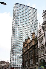 A tower block surrounded by shorter buildings