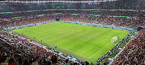 Photo showing the inside of the Education City Stadium in Qatar. This was one of many stadiums constructed by migrant workers under the Kafala system