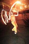 A firedancer in New York City using poi