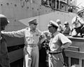 General MacArthur and Vice admiral Daniel E. Barbey leaving USS Nashville (CL-43) at Morotai on 15 September 1944