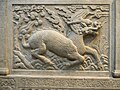 Image 62Gilin with the head and scaly body of a dragon, tail of a lion and cloven hoofs like a deer. Its body enveloped in sacred flames. Detail from Entrance of General Zu Dashou Tomb (Ming Tomb). (from Chinese culture)