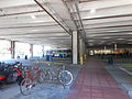 Bicycles and buses at the station.