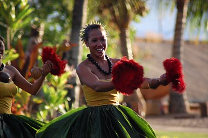 Hula dancers in a Luau in Lāhainā, in traditional kī leaf skirts