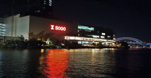 Night panorama, with building lights reflected in water