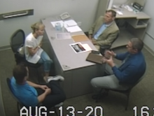 Sherri Papini and her husband, Keith Papini, being interrogated by police over a table with documents strewn on it