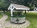 Non-functional water well made of glass bottles