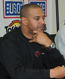 Freeman sitting with his chin on his hand