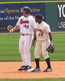 A baseball player in white