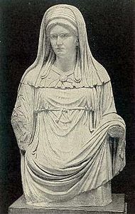 Statue of the chief Vestal Virgin, wearing a white palla and a white veil.