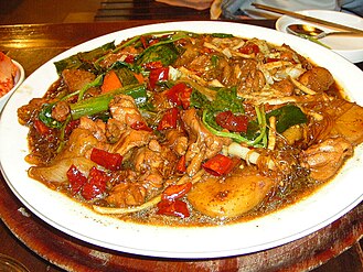 Andong jjimdak is a variety of jjim (a Korean steamed or boiled dish) made with chicken and various vegetables marinated in a ganjang based sauce.