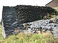 Detail of an old slate quarry wall in Rimogne.