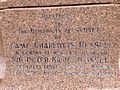 Plaque affixed to the base of the memorial statue for Russell on the grounds of the University of Sydney