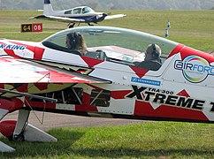 The low drag canopy of an Extra 300 aerobatic light aircraft.