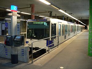 White metro vehicle at subway platform