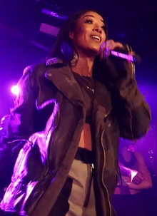 Mila J performing in 2018