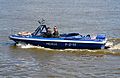 Water police patrol boat on the Vistula river in Warsaw, Poland