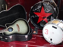 A drum kit and guitar
